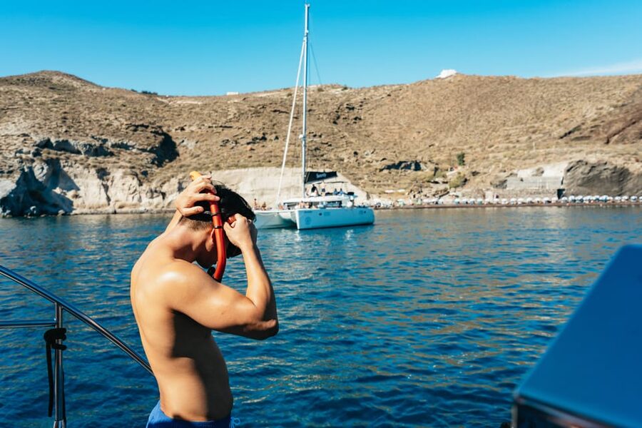 Santorini: Sailing Catamaran Cruise with BBQ and Drinks - Indian Rocks, the lighthouse, and the caldera