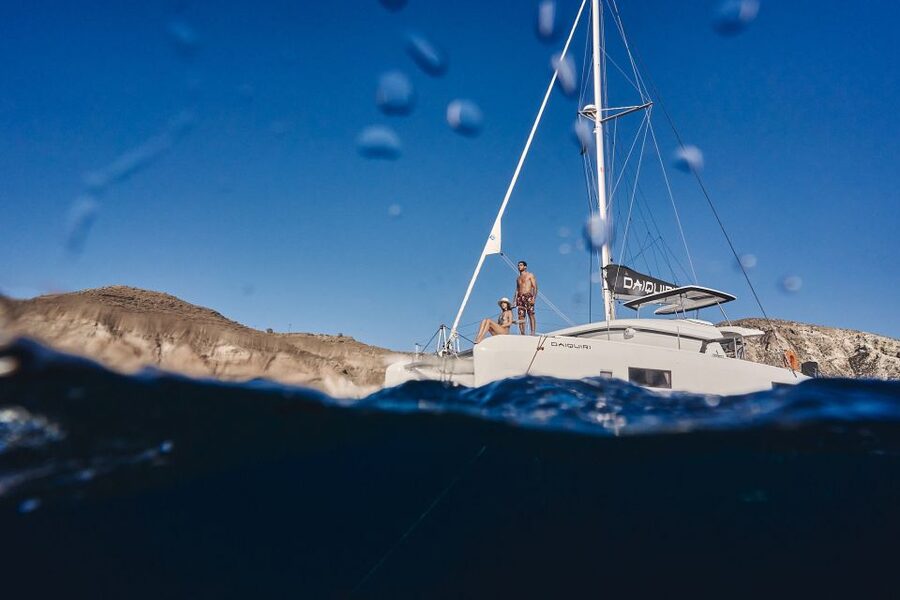 Santorini: Southern Island Luxury Catamaran Cruise with Meal - White Beach and Mesa Pigadia