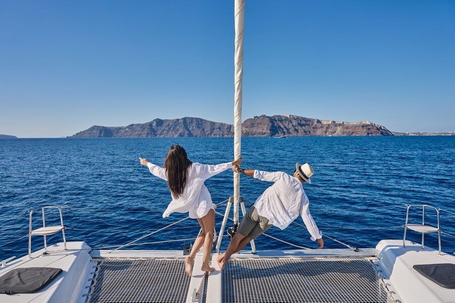 Santorini: Southern Island Luxury Catamaran Cruise with Meal - Akrotiri Lighthouse and the volcanic coast
