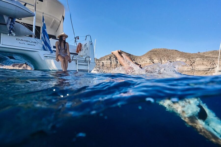 Santorini: Southern Island Luxury Catamaran Cruise with Meal - Nea Kameni: black lava and sulfur water