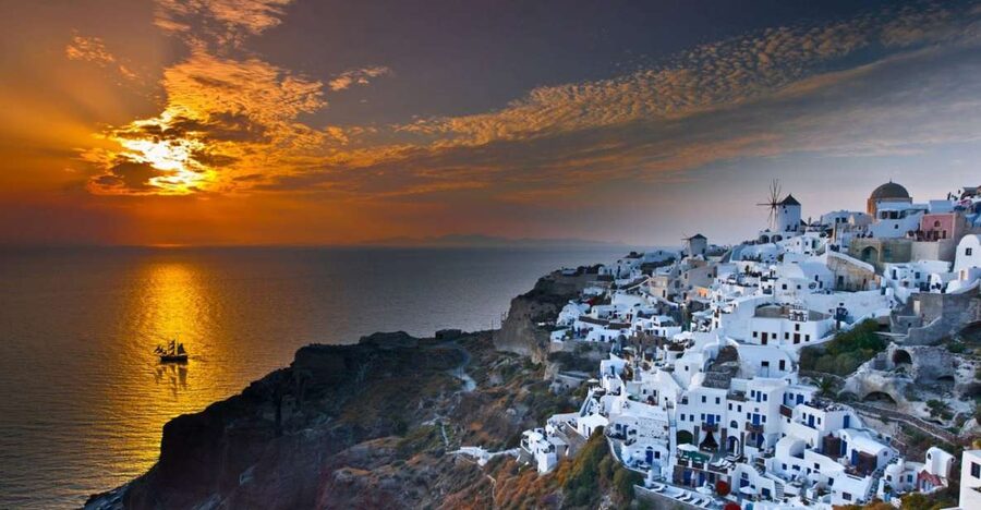 Santorini: Volcanic Sunset Cruise with Dinner - Setting Sail from Athinios Port on a Wooden Caique