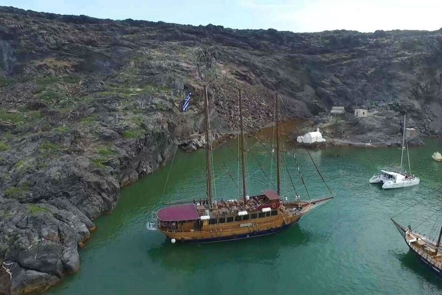 Santorini: Volcanic Sunset Cruise with Dinner - The Volcano Stop and Santorini’s Dark Origins