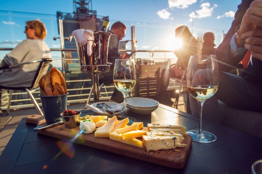 Santorini: Volcano and Hot Springs Sunset Dinner Cruise - From your hotel to Athinios Port