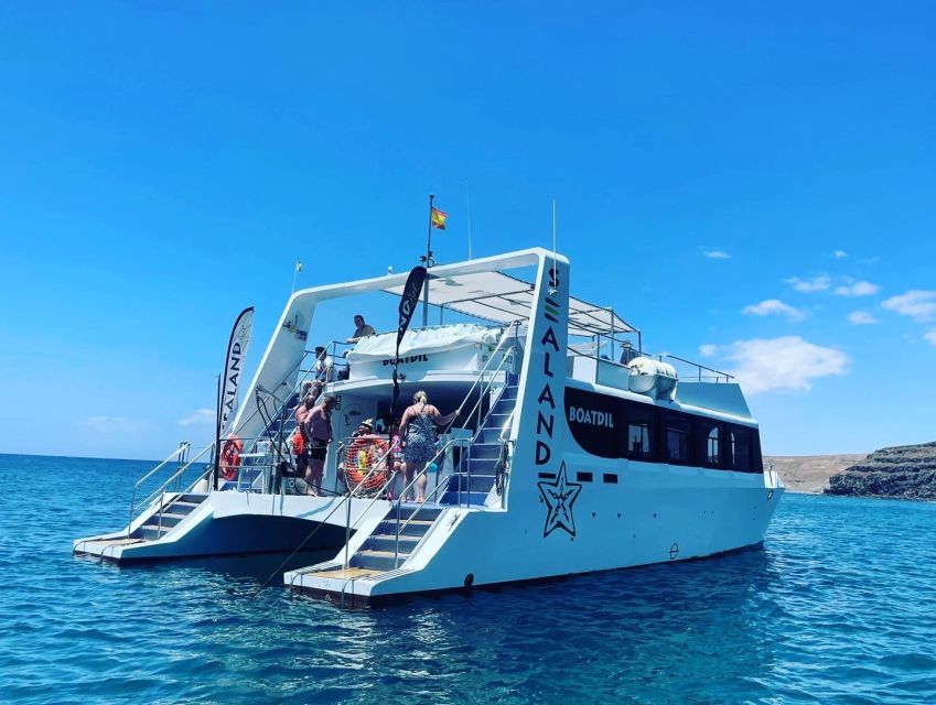 Southeast Fuerteventura: Boat Cruise with Lunch and Drinks - Boarding the double-deck catamaran