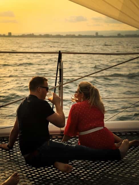 Sunny Beach: Sunset Catamaran Cruise with Dinner & Prosecco - From Sunny Beach to the harbor by red London bus