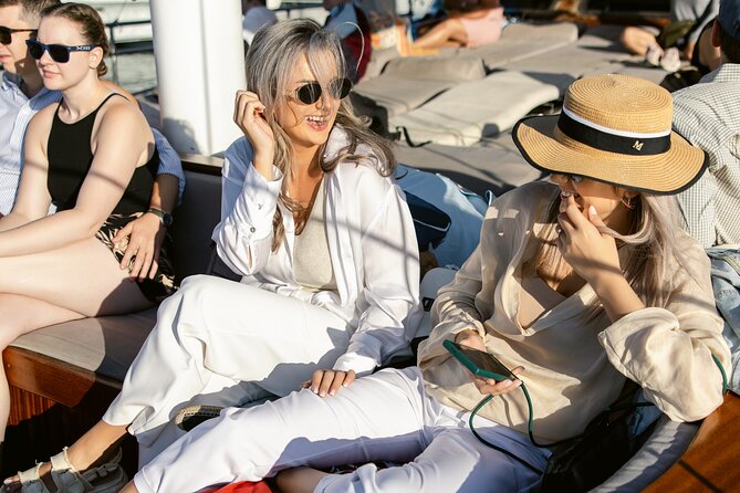 Sunset Dinner Cruise: Sunset, Swim, Drinks, and Dinner Onboard - Booking, Weather, and Practical Details