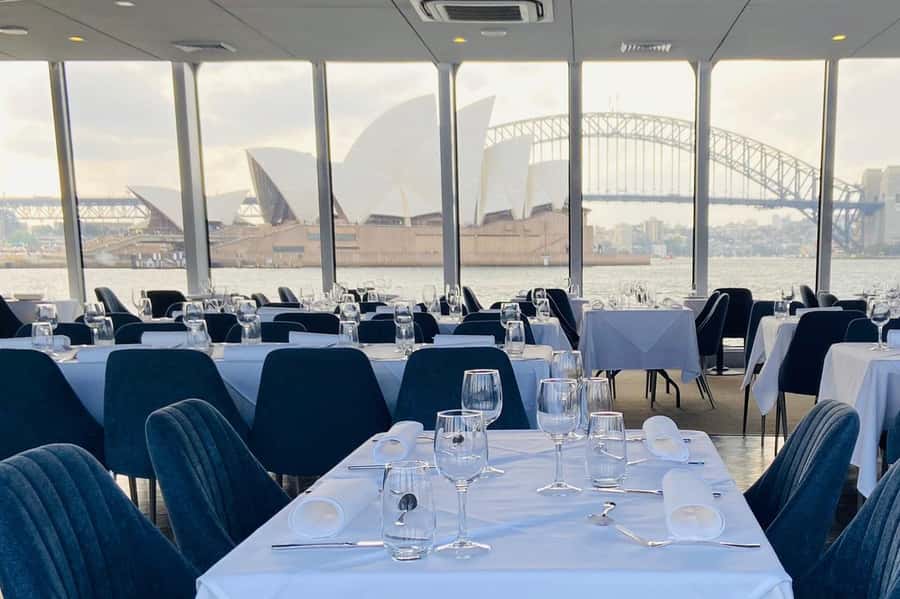 Sydney Harbour Lunch Cruise: 360° Glass Boat Views & Buffet - A glass boat with a seat for the view