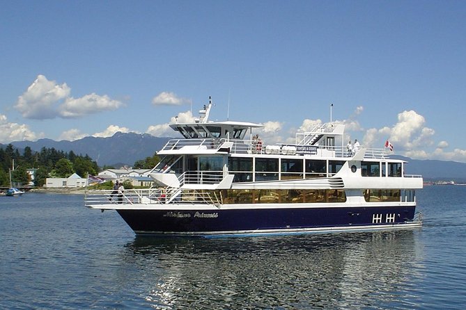 Vancouver - Brunch and Lunch Cruise - Burrard Inlet shifts from city views to mountain walls